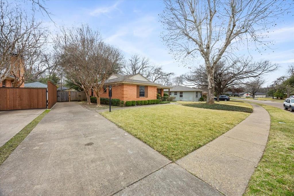 10524 Coleridge Street Dallas, TX 75218 - Photo 34 of 35 a front view of house with yard and trees around