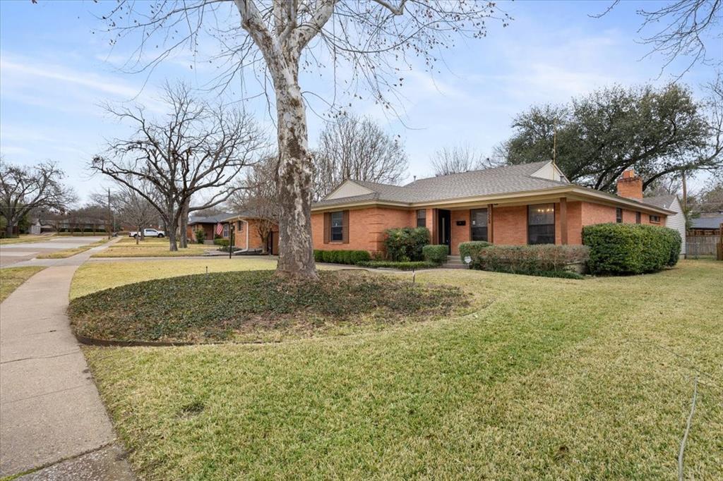 10524 Coleridge Street Dallas, TX 75218 - Photo 35 of 35 a front view of a house with a yard