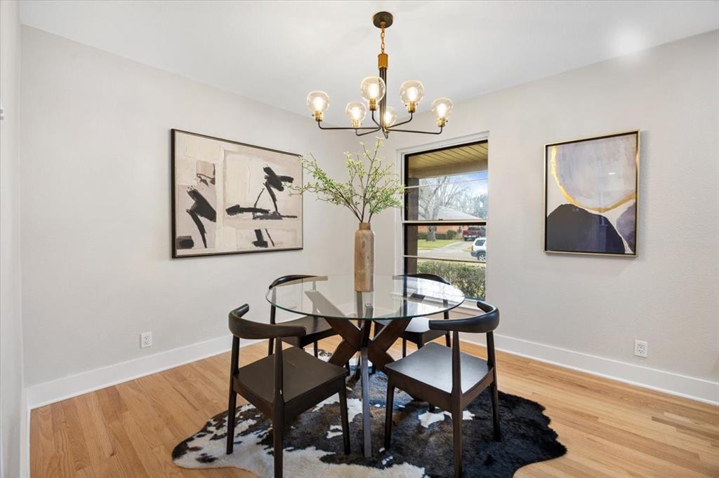 10524 Coleridge Street Dallas, TX 75218 - Photo 4 of 35 a view of a dining room with furniture wooden floor and painting