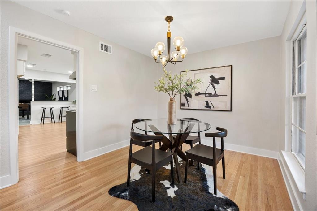 10524 Coleridge Street Dallas, TX 75218 - Photo 6 of 35 a view of a dining room with furniture wooden floor and chandelier