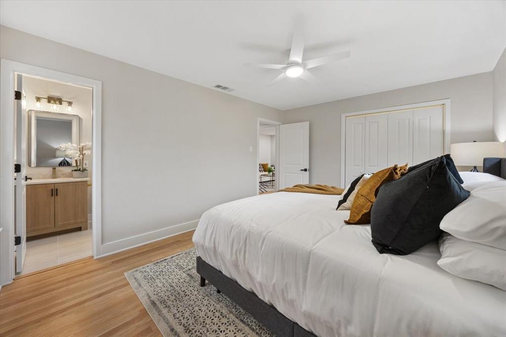 10524 Coleridge Street Dallas, TX 75218 - Photo 10 of 35 a bedroom with a bed and a view of kitchen