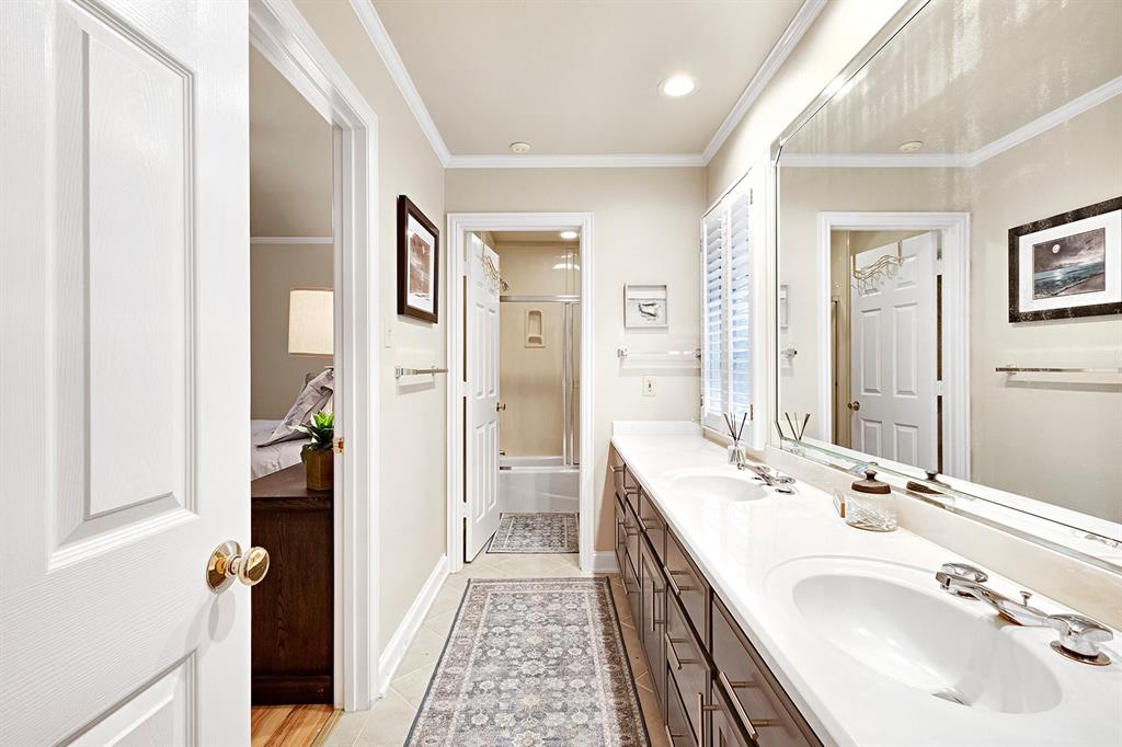 103 Glenn Road Mabank, TX 75156 - Photo 28 of 38 a spacious bathroom with a double vanity sink and a mirror