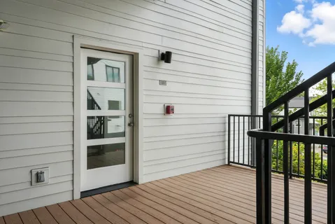 a view of front door and deck of the house