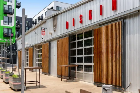 a view of a house with potted plants
