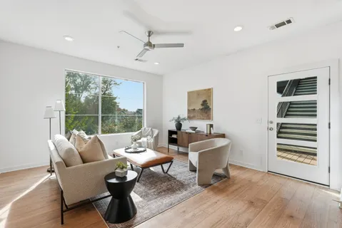 a living room with furniture and a window