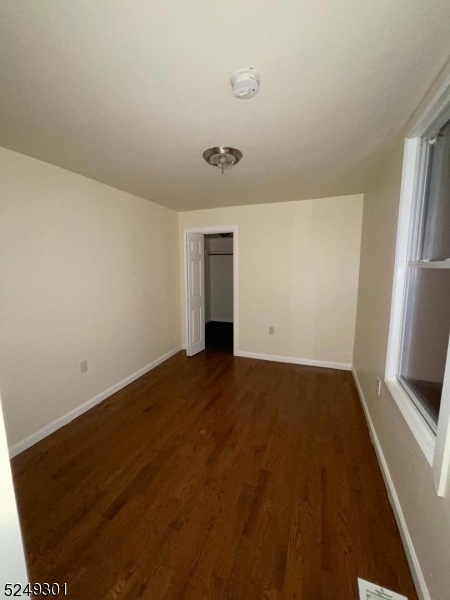 89 Cutler Street, Unit 1 Newark, NJ 07104 - Photo 6 of 7 an empty room with windows