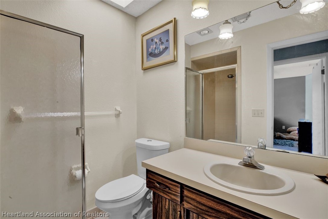 4204 Medina Way Sebring, FL 33875 - Photo 17 of 25 a bathroom with a sink toilet and shower