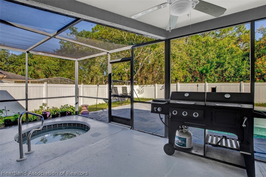 4204 Medina Way Sebring, FL 33875 - Photo 22 of 25 a view of a patio with a table and chairs