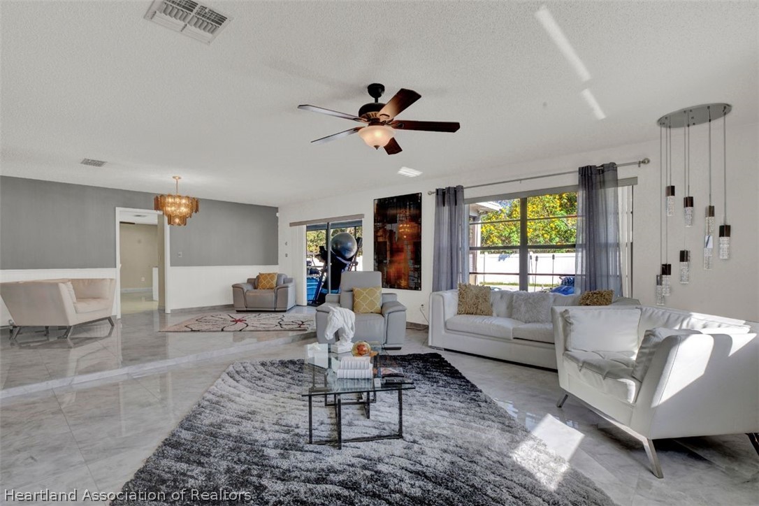 4204 Medina Way Sebring, FL 33875 - Photo 7 of 25 a living room with furniture or couch and a window