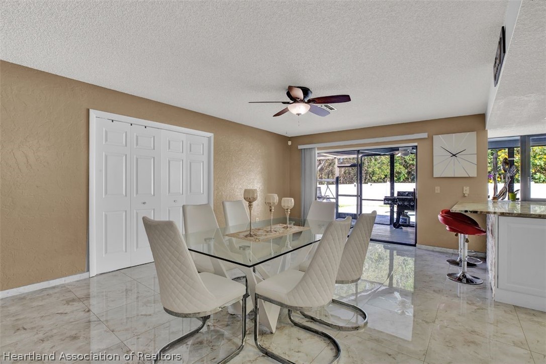 4204 Medina Way Sebring, FL 33875 - Photo 9 of 25 a view of a dining room with furniture