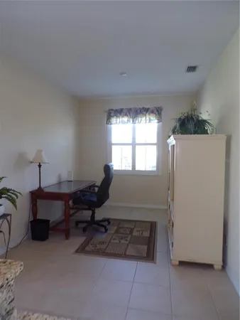 a kitchen with stainless steel appliances granite countertop a refrigerator a stove a sink and a microwave