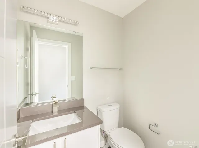 a view of a hallway with stairs