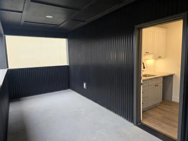 a kitchen with a sink cabinets and a window