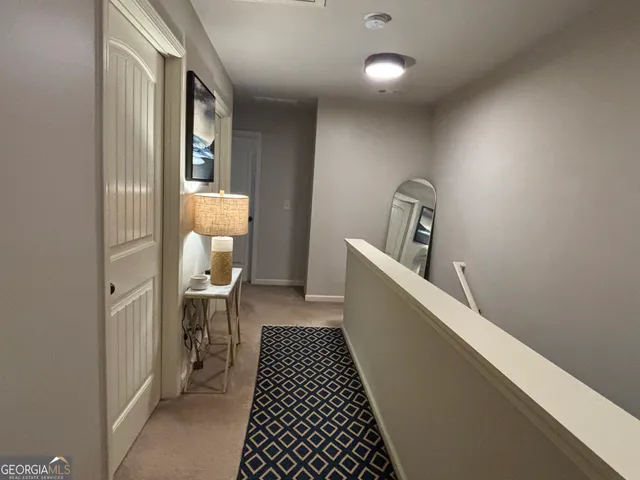 a view of a hallway with a dining room