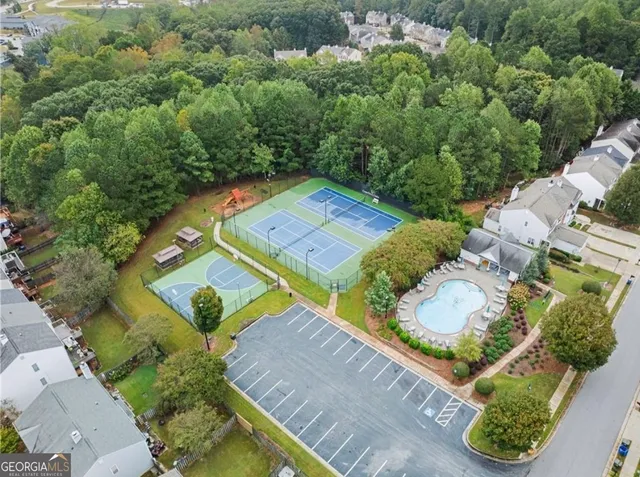 an aerial view of a house a yard and lake view
