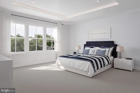 a spacious bedroom with a bed and a large window