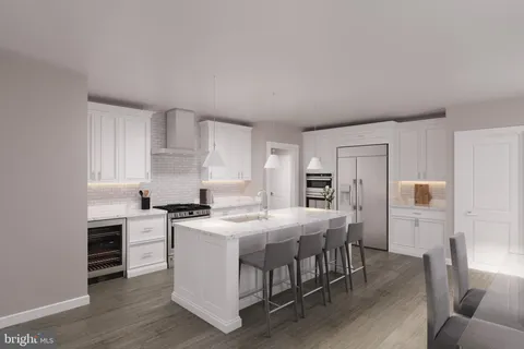 a kitchen that has a table and chairs in it