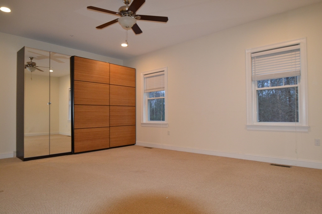 8 Cheyenne Valley, Unit 8 Westford, MA 01886 - Photo 12 of 27 a view of an empty room with a window