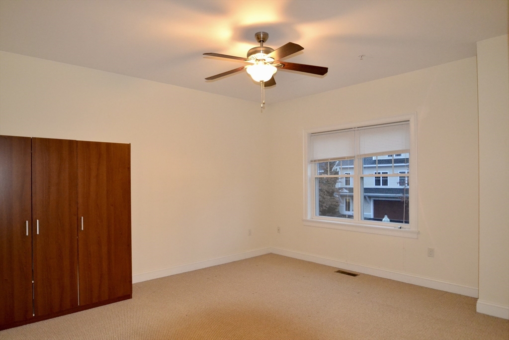 8 Cheyenne Valley, Unit 8 Westford, MA 01886 - Photo 17 of 27 a view of an empty room with a window