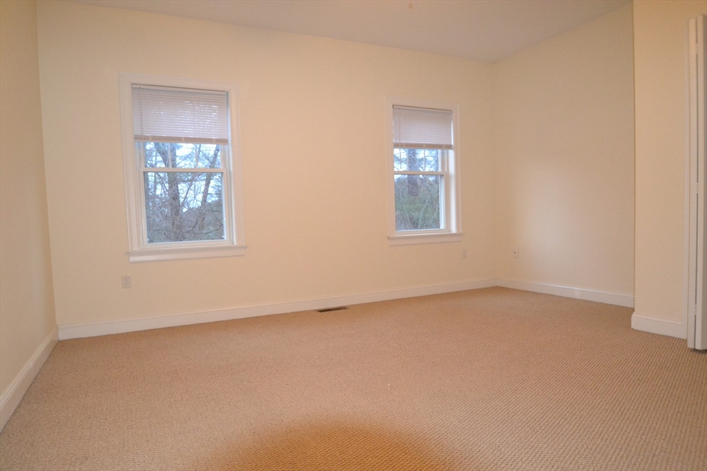 8 Cheyenne Valley, Unit 8 Westford, MA 01886 - Photo 20 of 27 an empty room with windows