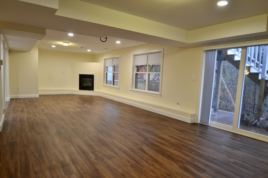 8 Cheyenne Valley, Unit 8 Westford, MA 01886 - Photo 23 of 27 a view of an empty room with wooden floor and a window