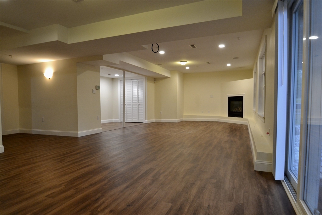 8 Cheyenne Valley, Unit 8 Westford, MA 01886 - Photo 24 of 27 a view of a hallway with wooden floor