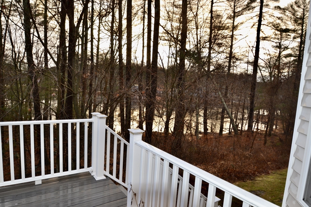 8 Cheyenne Valley, Unit 8 Westford, MA 01886 - Photo 3 of 27 a view of balcony with wooden floor and fence