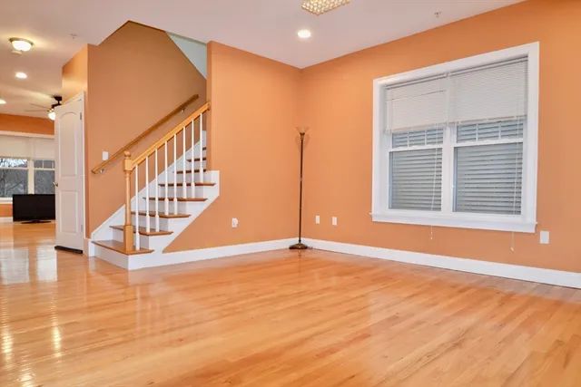 a view of an entryway with wooden floor