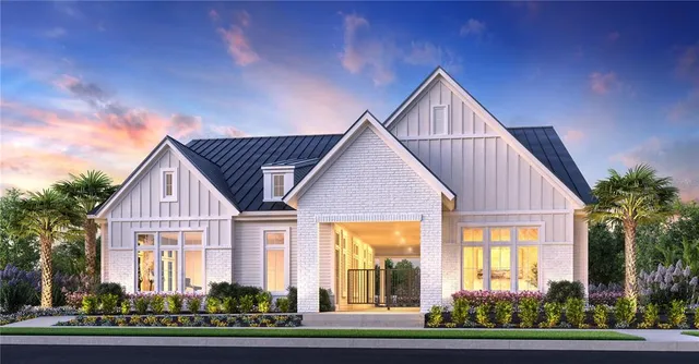 a view of a house with a yard and plants