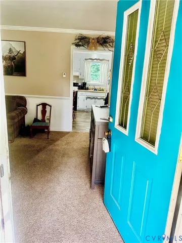 a dining room with furniture and a window