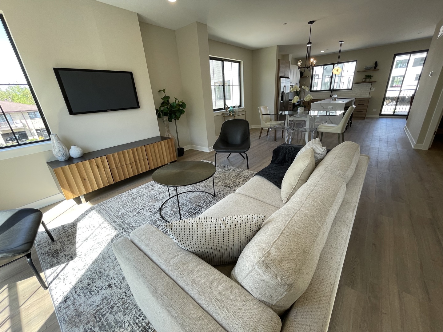 425 Bloom Street, Unit U Highland Park, IL 60035 - Photo 7 of 8 a living room with furniture and a flat screen tv