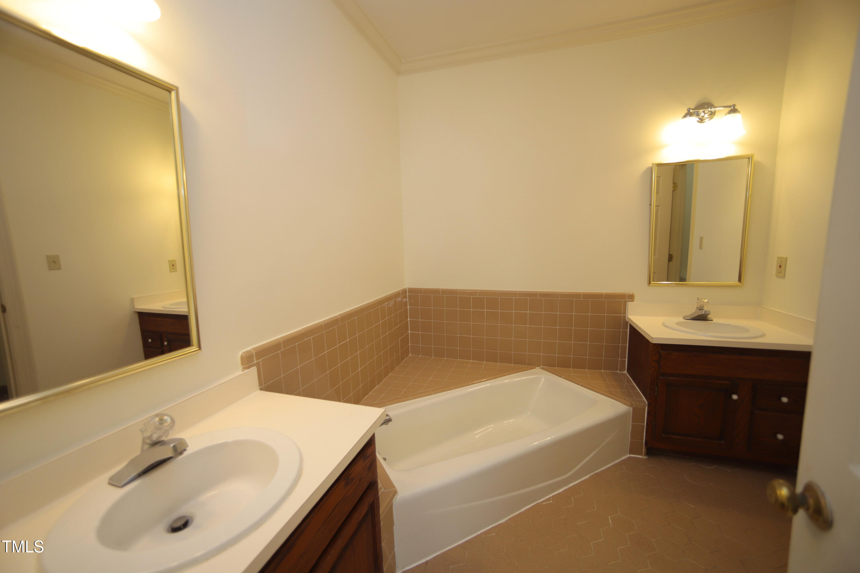 Main bath on main level. Tub, separate shower and two vanities