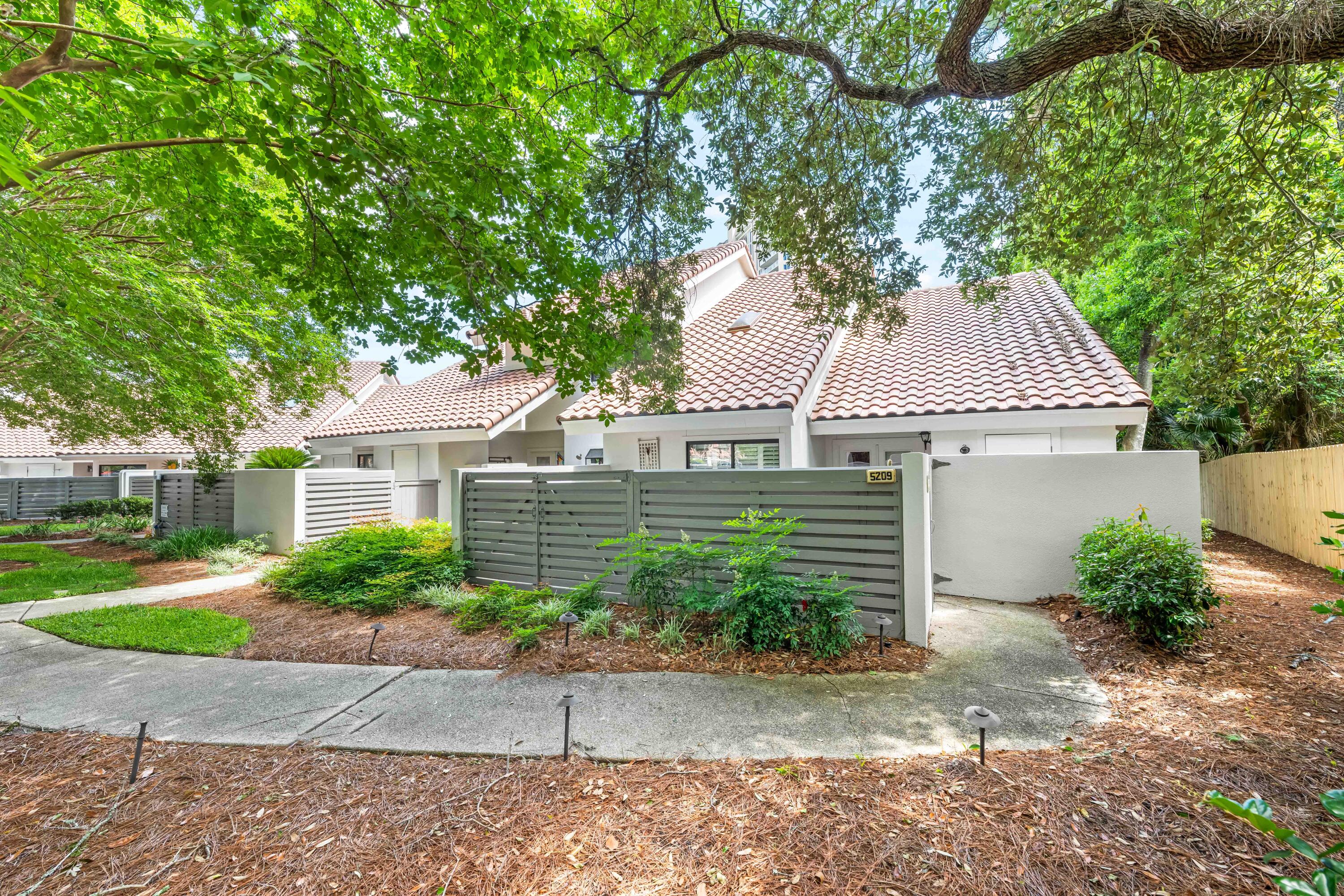 5209 Beachwalk Drive Miramar Beach, FL 32550 - Photo 1 of 50 Beachwalk Villas 5209 sidewalk to entry