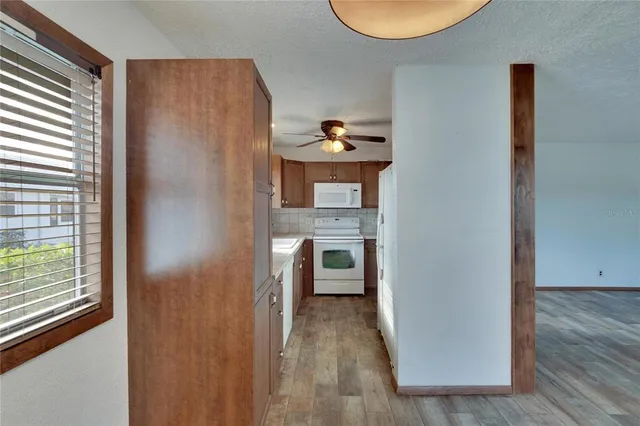a view of living room with furniture and window