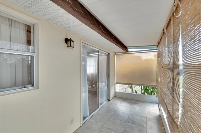 a view of a bathroom with a tub and shower