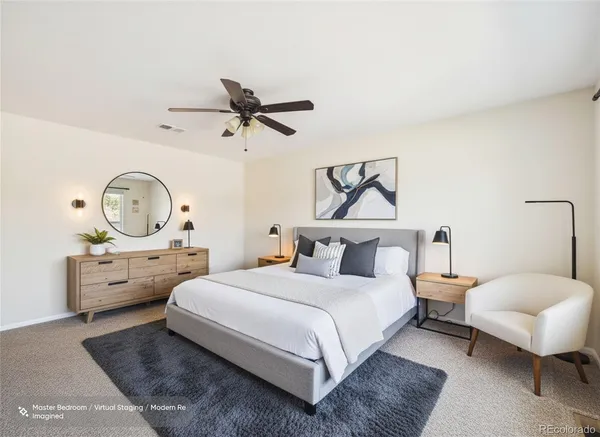 a bed room with a bed and a chandelier