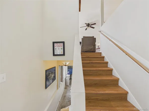 a view of staircase with white walls