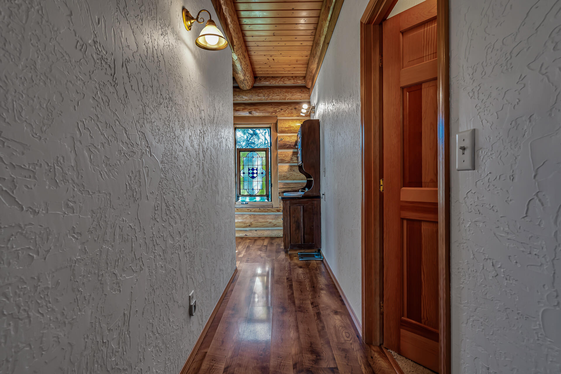 43007 Shoshoni Loop Fall River Mills, CA 96028 - Photo 45 of 87 a view of a hallway with wooden floor