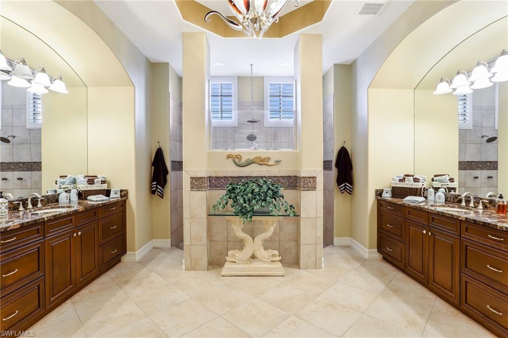 7433 Byrons Way Naples, FL 34113 - Photo 21 of 34 a view of a kitchen with a sink and cabinets