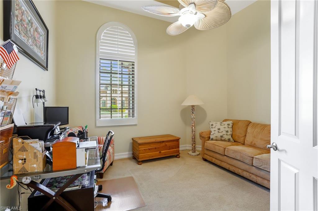 7433 Byrons Way Naples, FL 34113 - Photo 24 of 34 a living room with furniture and a window