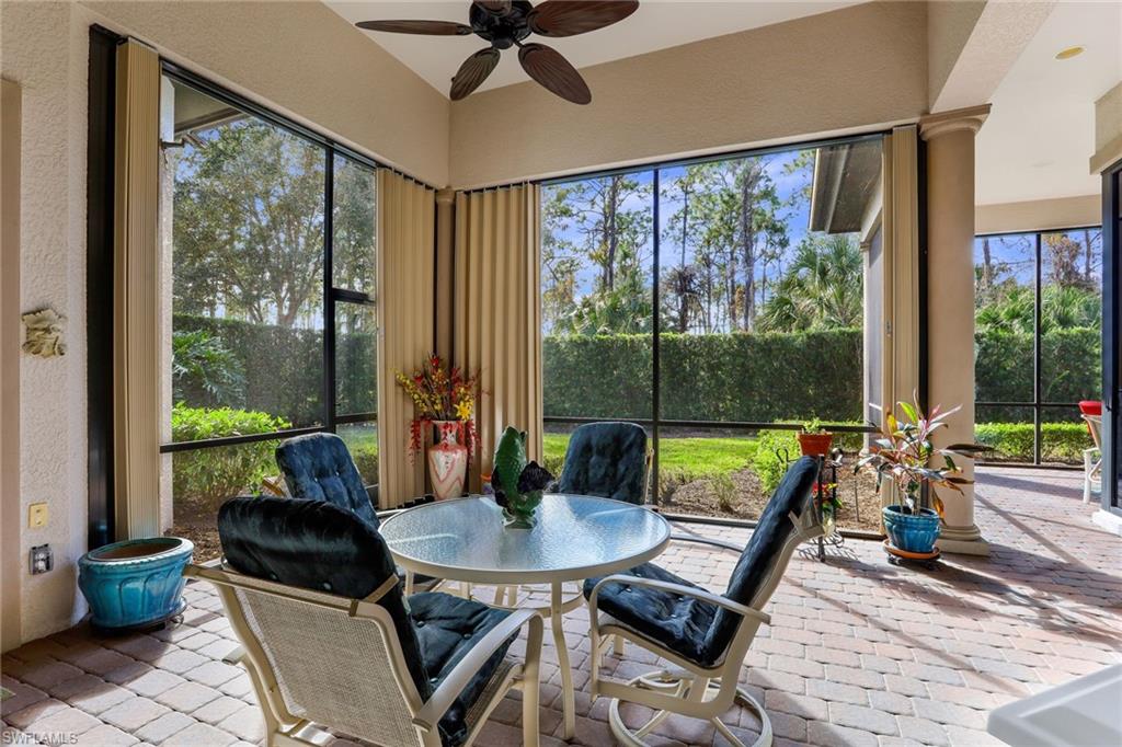 7433 Byrons Way Naples, FL 34113 - Photo 28 of 34 a living room with furniture and a window
