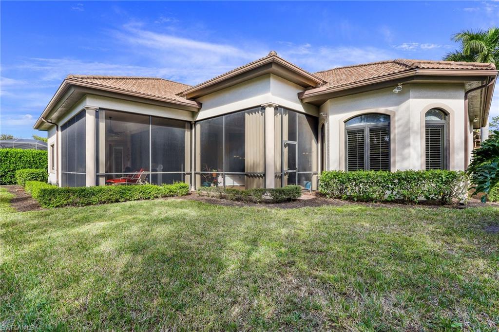 7433 Byrons Way Naples, FL 34113 - Photo 29 of 34 a view of a house with yard and plants