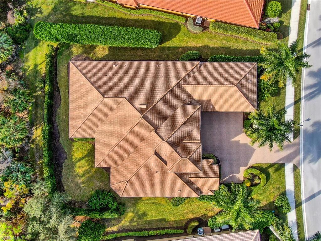 7433 Byrons Way Naples, FL 34113 - Photo 5 of 34 an aerial view of a house with a yard and potted plants