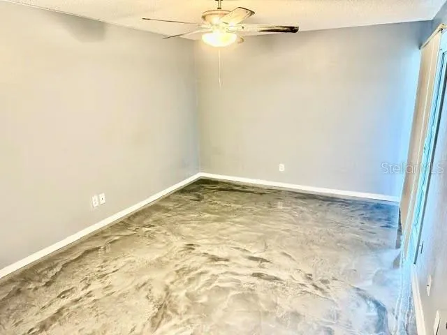 a view of a room with a empty space and a window