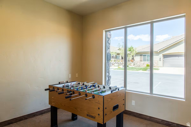 4257 Razor Drive Washington, UT 84780 - Photo 55 of 58 Recessed wall niche featuring a large picture window with stone surround, neutral painted walls, and carpet flooring