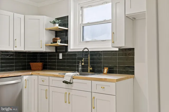 a kitchen with a sink and cabinets