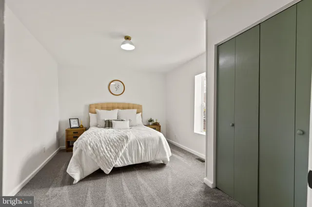 a bedroom with a bed and window