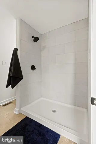 a bathroom with a sink vanity and a mirror