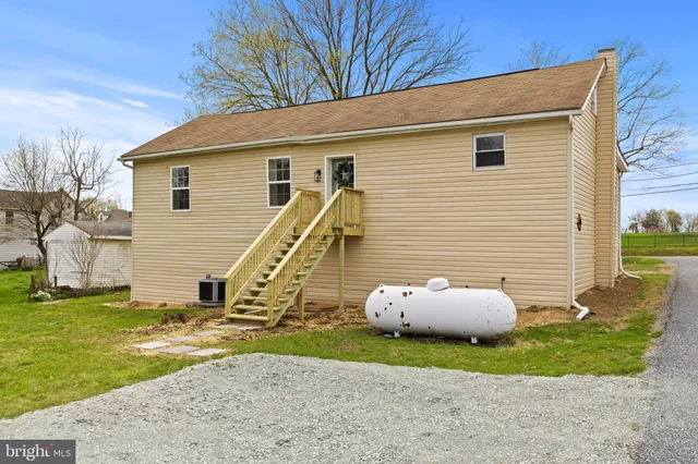 a view of a swimming pool with a patio and yard