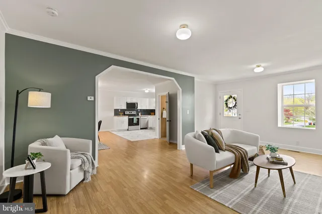 a living room with furniture and a table